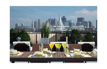 Select 1 and 2 bedroom apartments feature private balcony with boston seaport and city skyline views